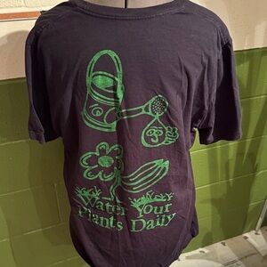 Altru Black Tee with Green water your plants daily